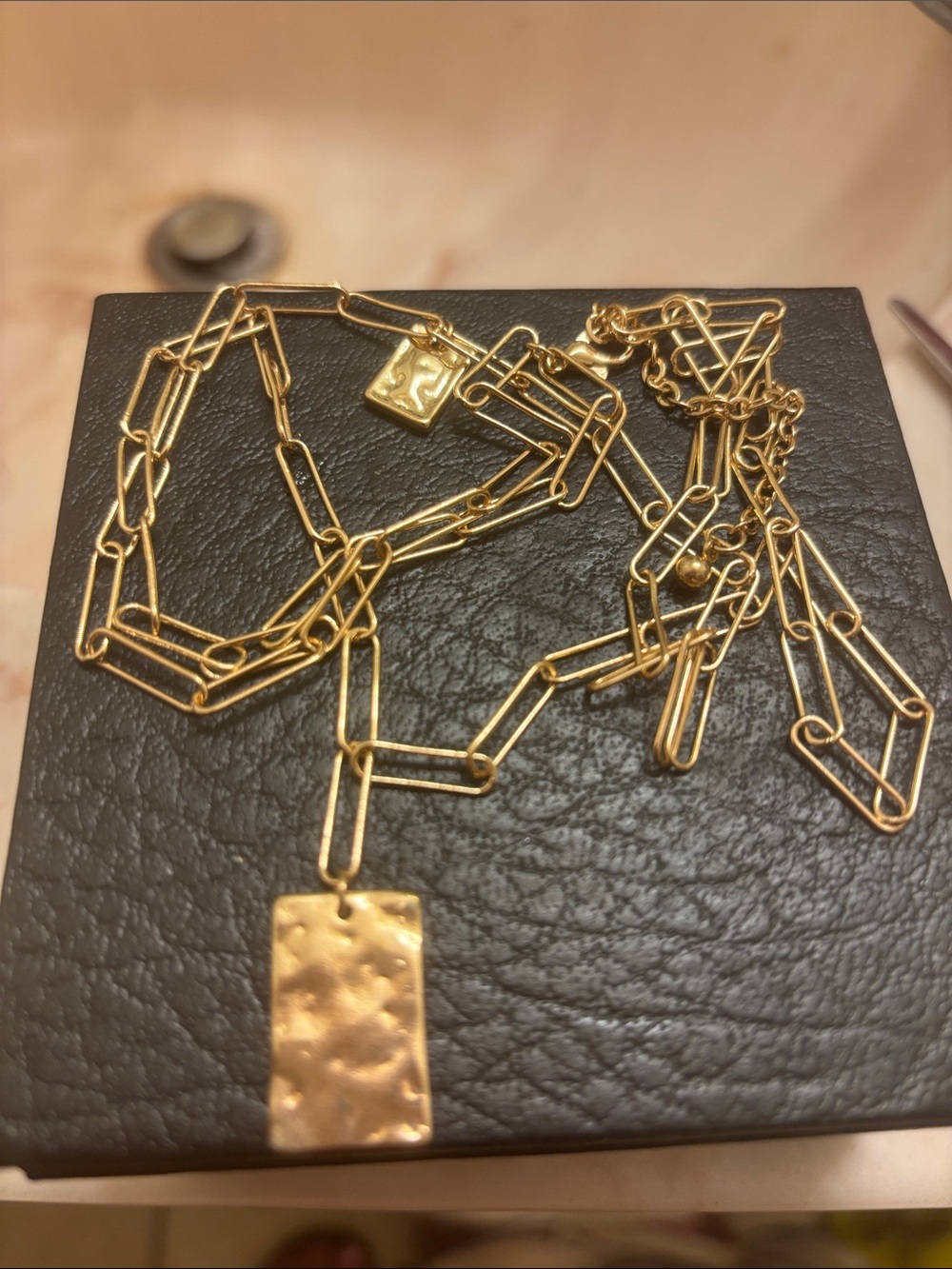 Cartier: Gold Paperclip Chain Necklace with Hammered Pendant